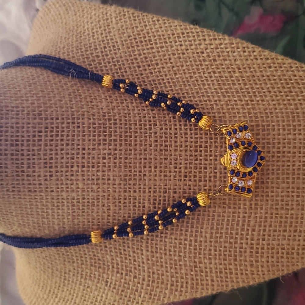 Beautiful blue & gold statement necklace In Egyptian Design.